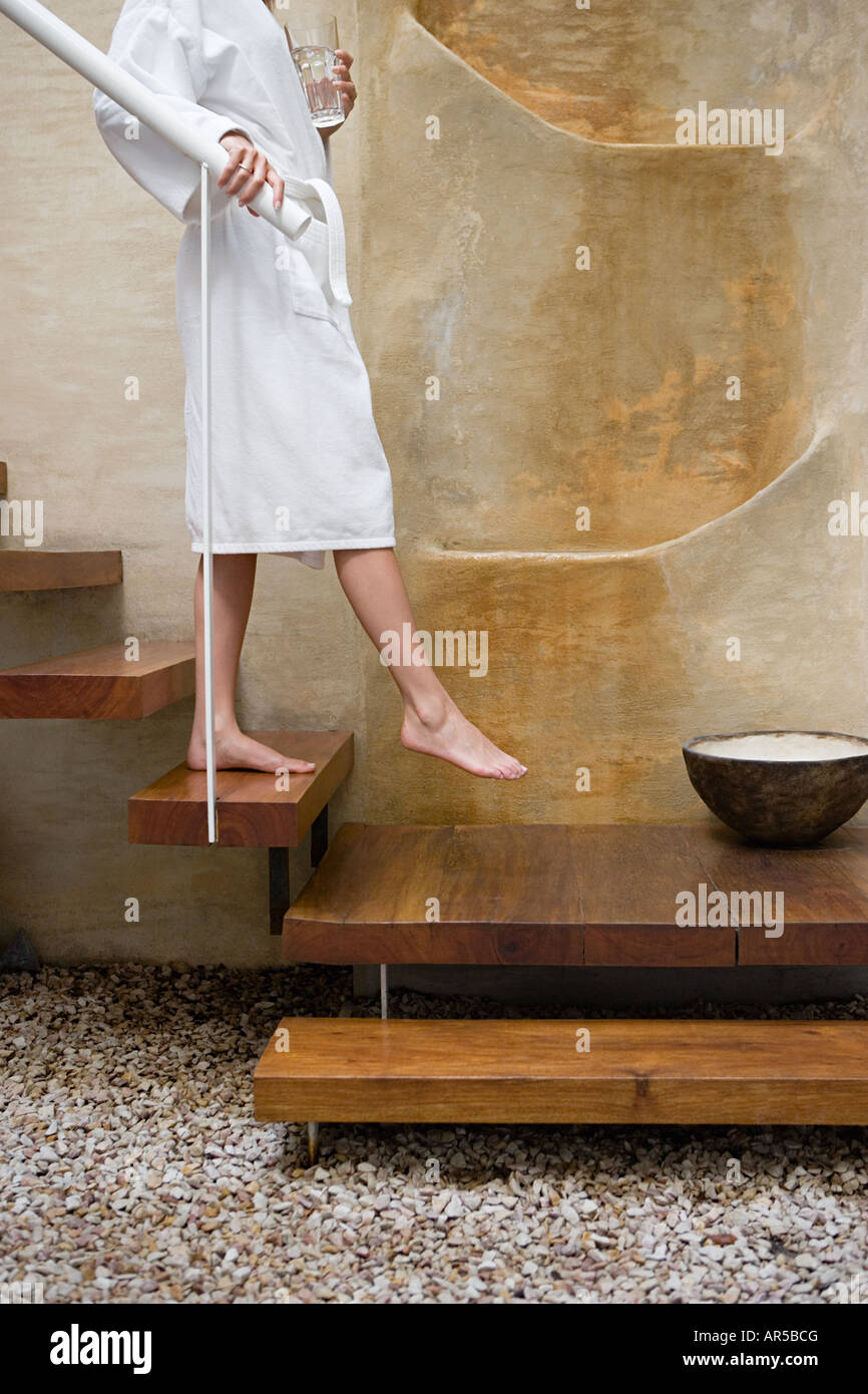 Person walking down steps Stock Photo - Alamy