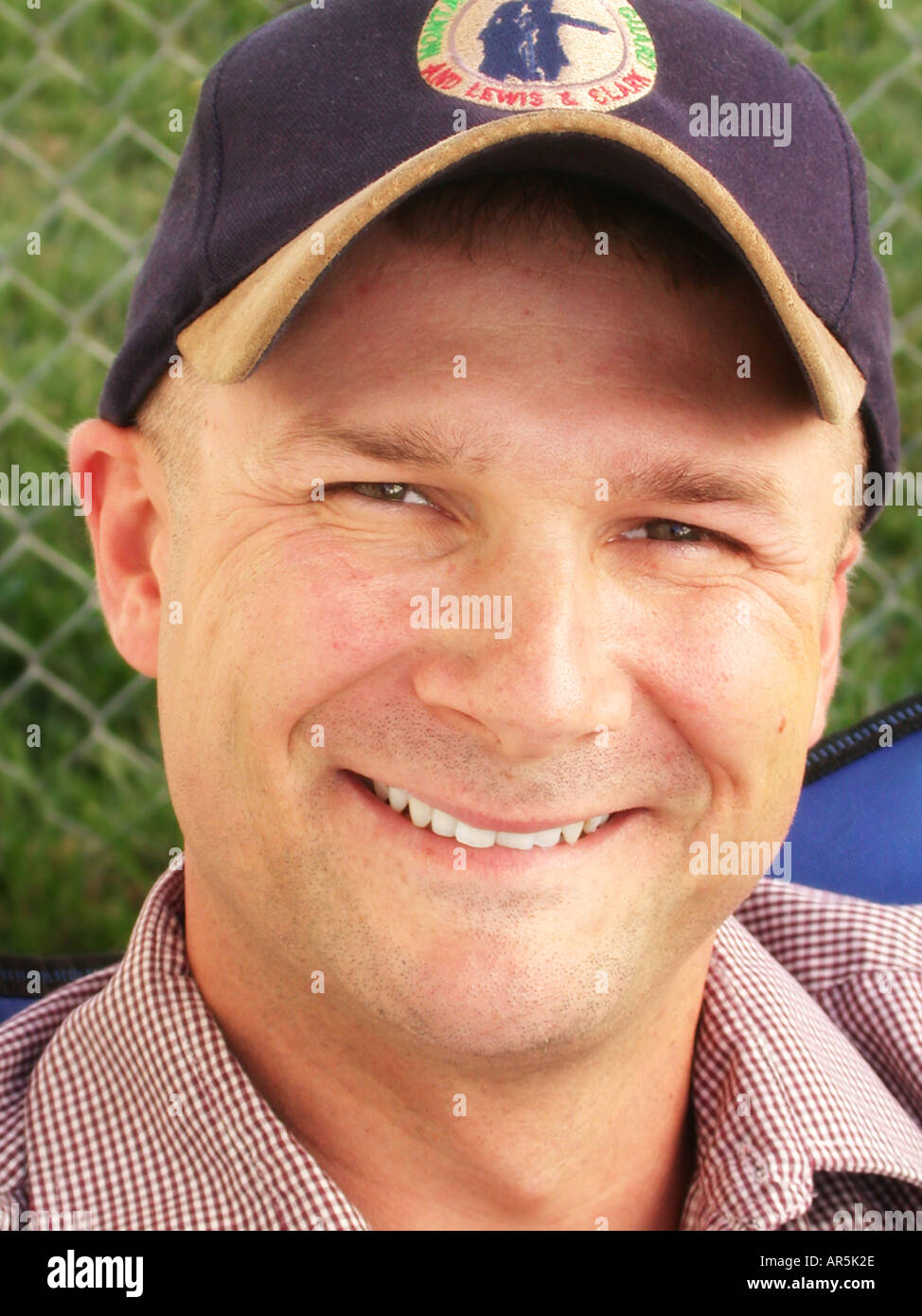 Man in Baseball Cap Smiling Stock Photo Alamy
