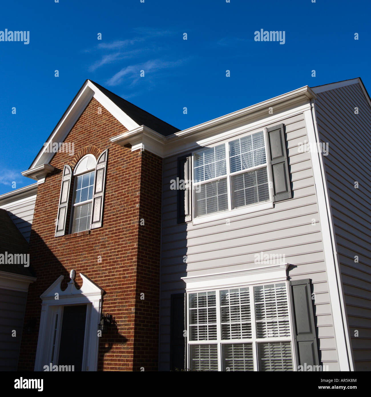 Photo inspiration: Fresh Look at Exterior Of Brick And Vinyl Siding House Stock Photo