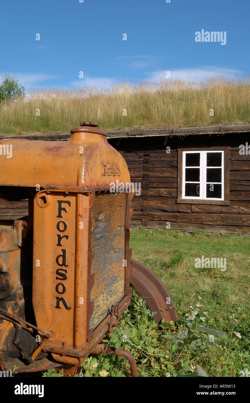 Old Fordson tractor and historic wooden buildings, open air museum near Bardufoss, Norway Stock Photo