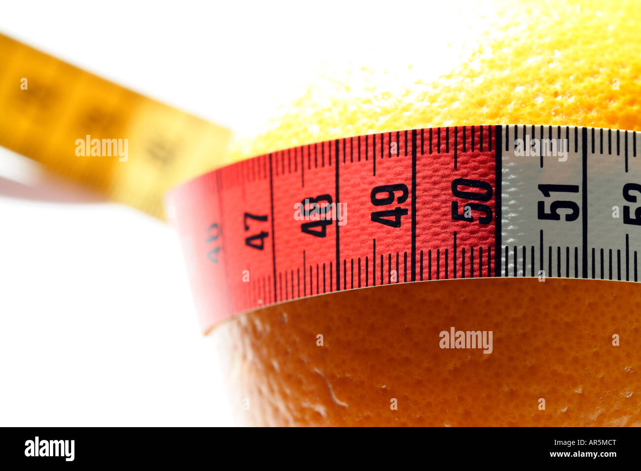 Tape measure and orange Stock Photo - Alamy