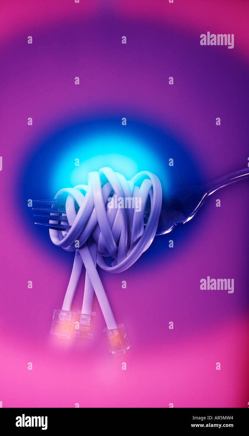 Telephone line wrapped on fork Stock Photo