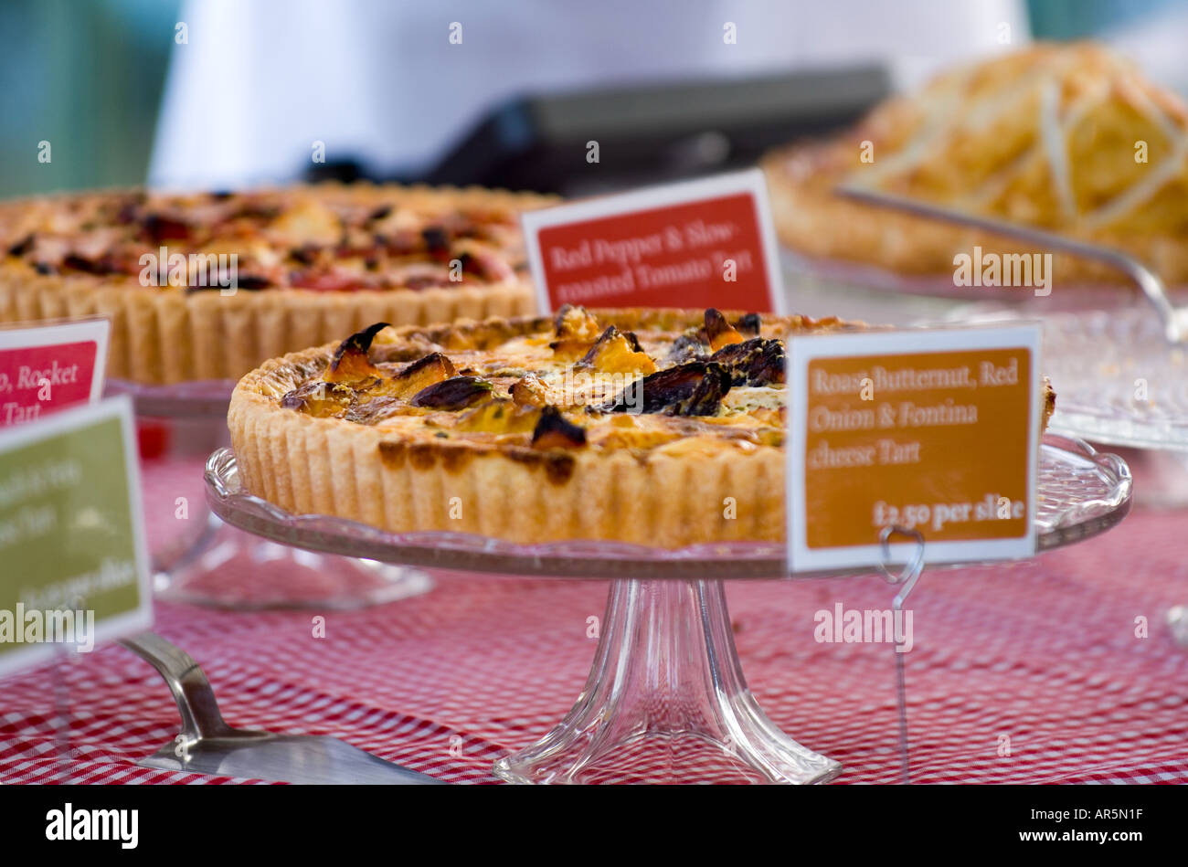 Savoury tarts display at farmers market Stock Photo