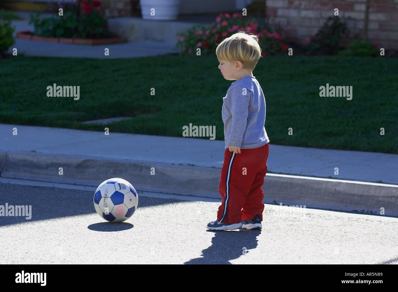 toddler with soccer ball Stock Photo