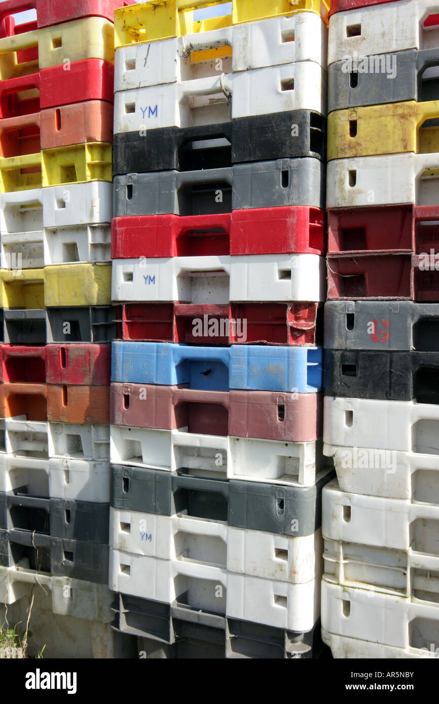 Stacked colourful crates used by fisherman at Lulworth Cove, on the