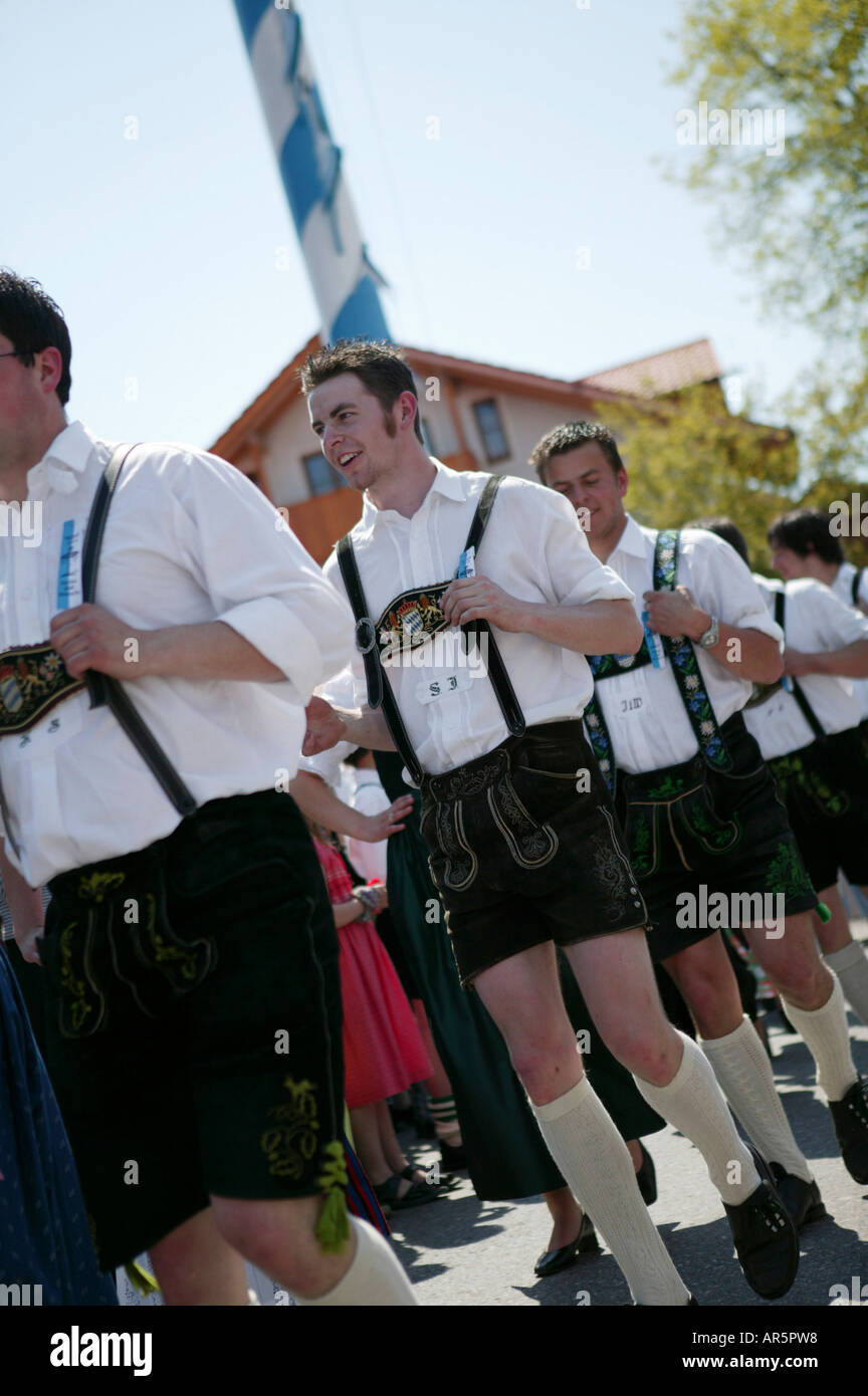 Young men in traditional bavarian clothes at 1st of May celebration, Muensing, bavaria, Germany Stock Photo