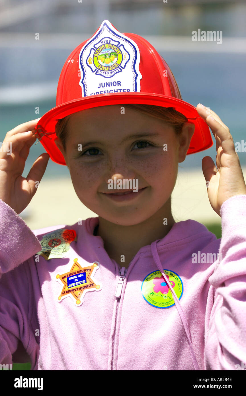 girl with fireman hat Stock Photo