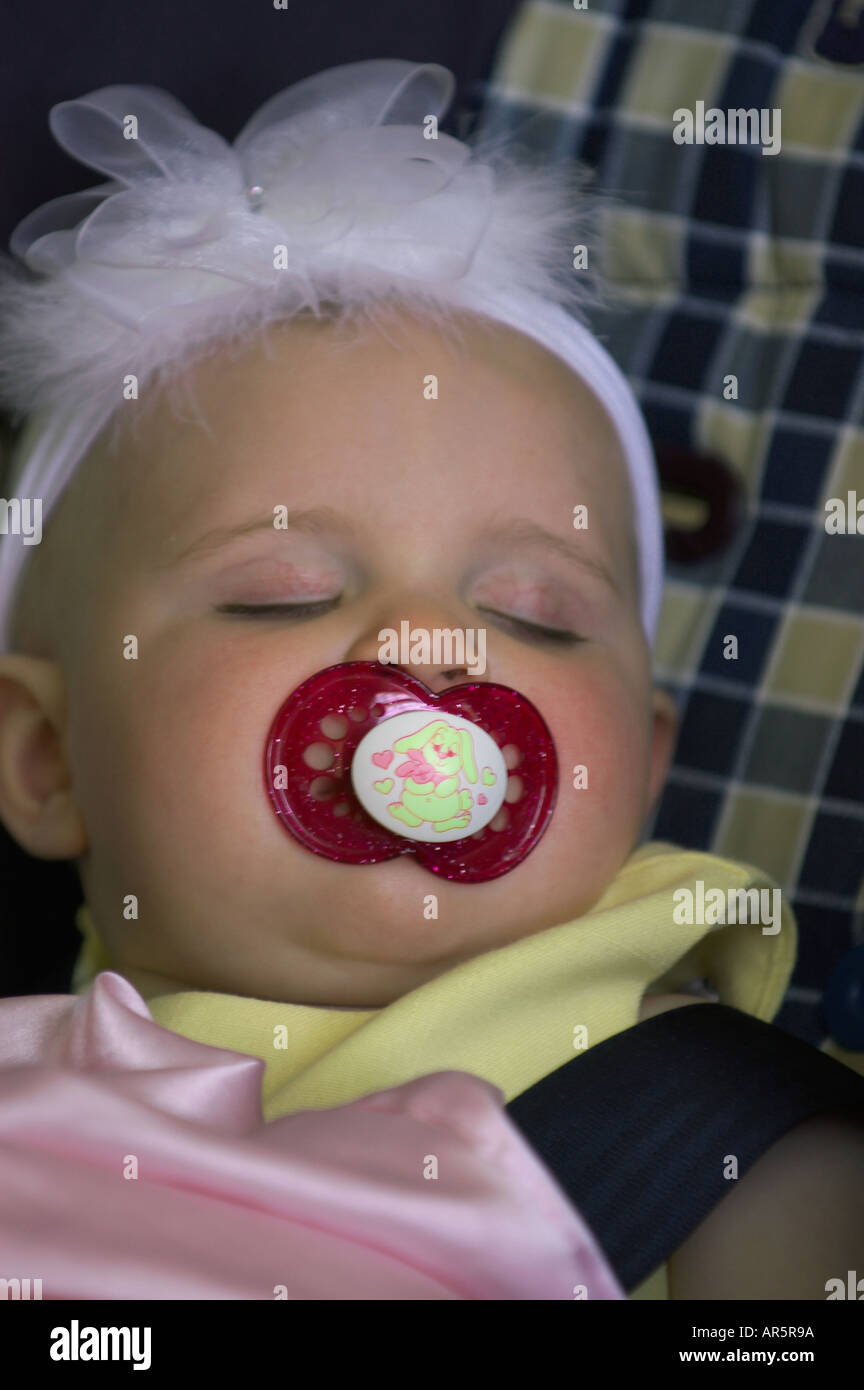 sleeping baby girl with pacifier Stock Photo