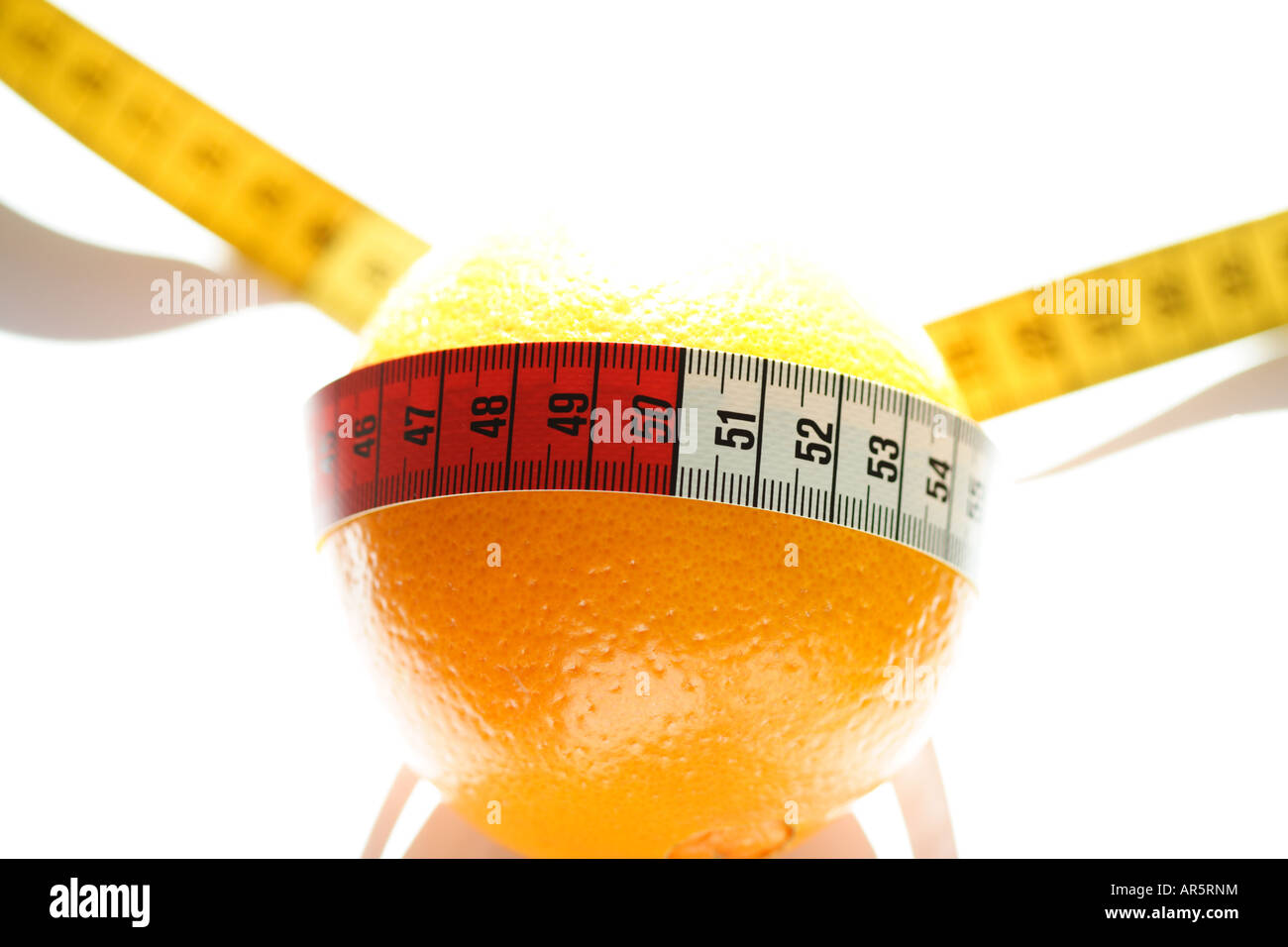 Tape measure and orange Stock Photo - Alamy