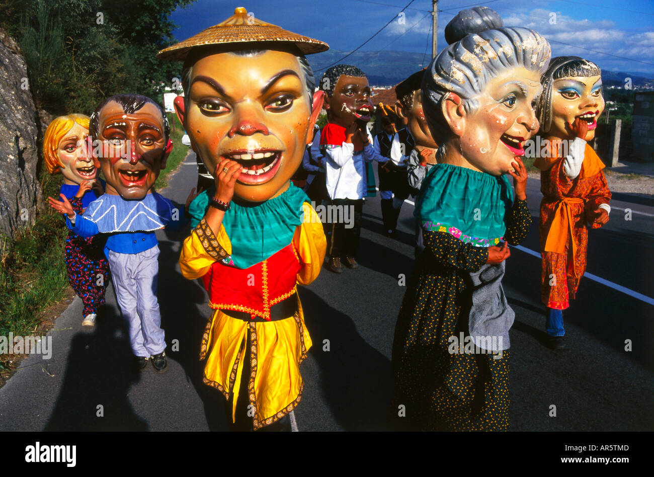 Procession of giant heads, village festival, San Juan de Poio, Province Pontevedra, Galicia, Spain Stock Photo