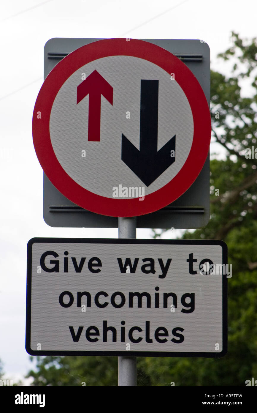 Give way to oncoming vehicles road sign Stock Photo