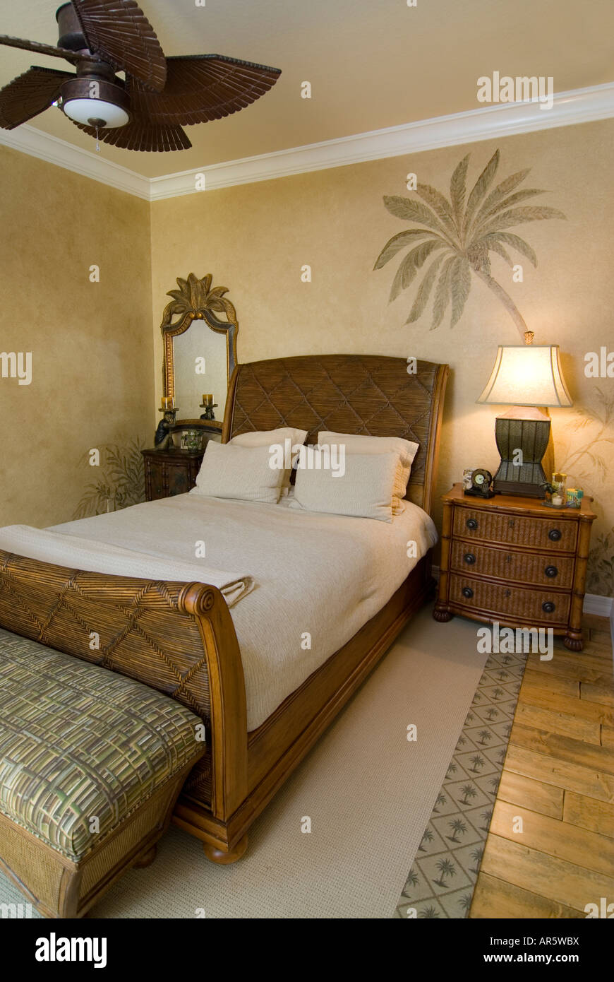 Tropical style bedroom with ceiling fan Stock Photo