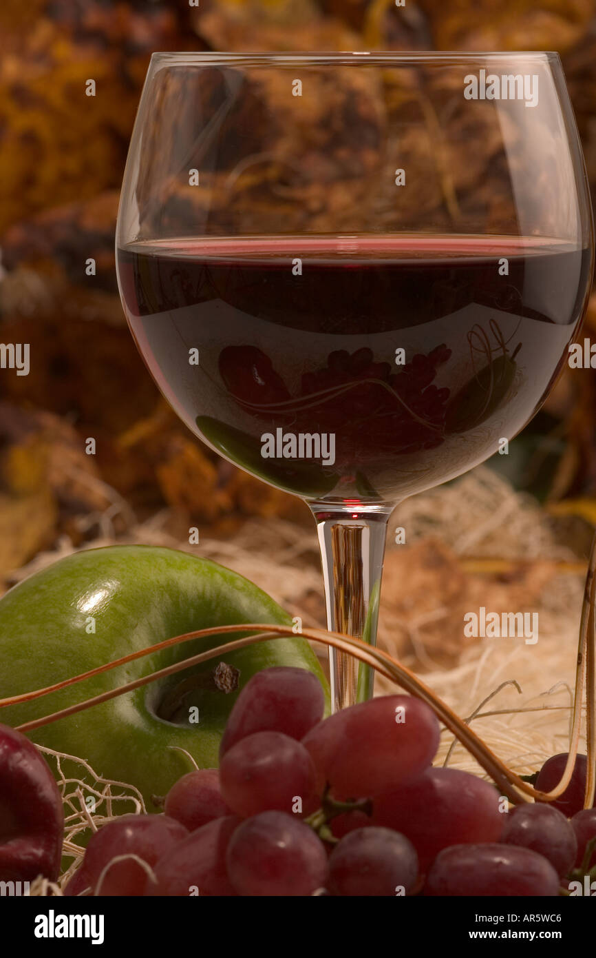 Still life with a glass of wine and fruits Stock Photo - Alamy