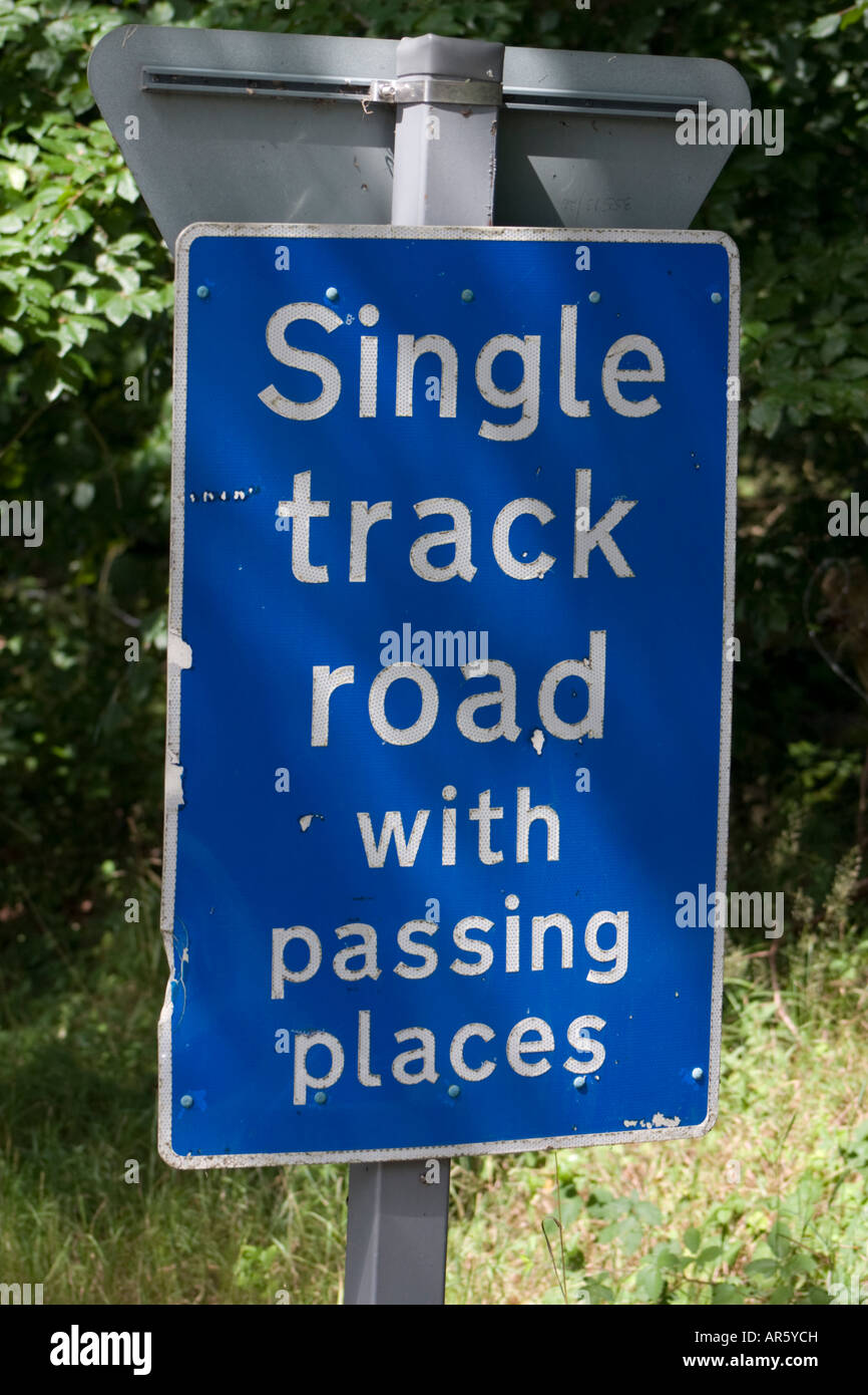 Single track road with passing places road sign Stock Photo