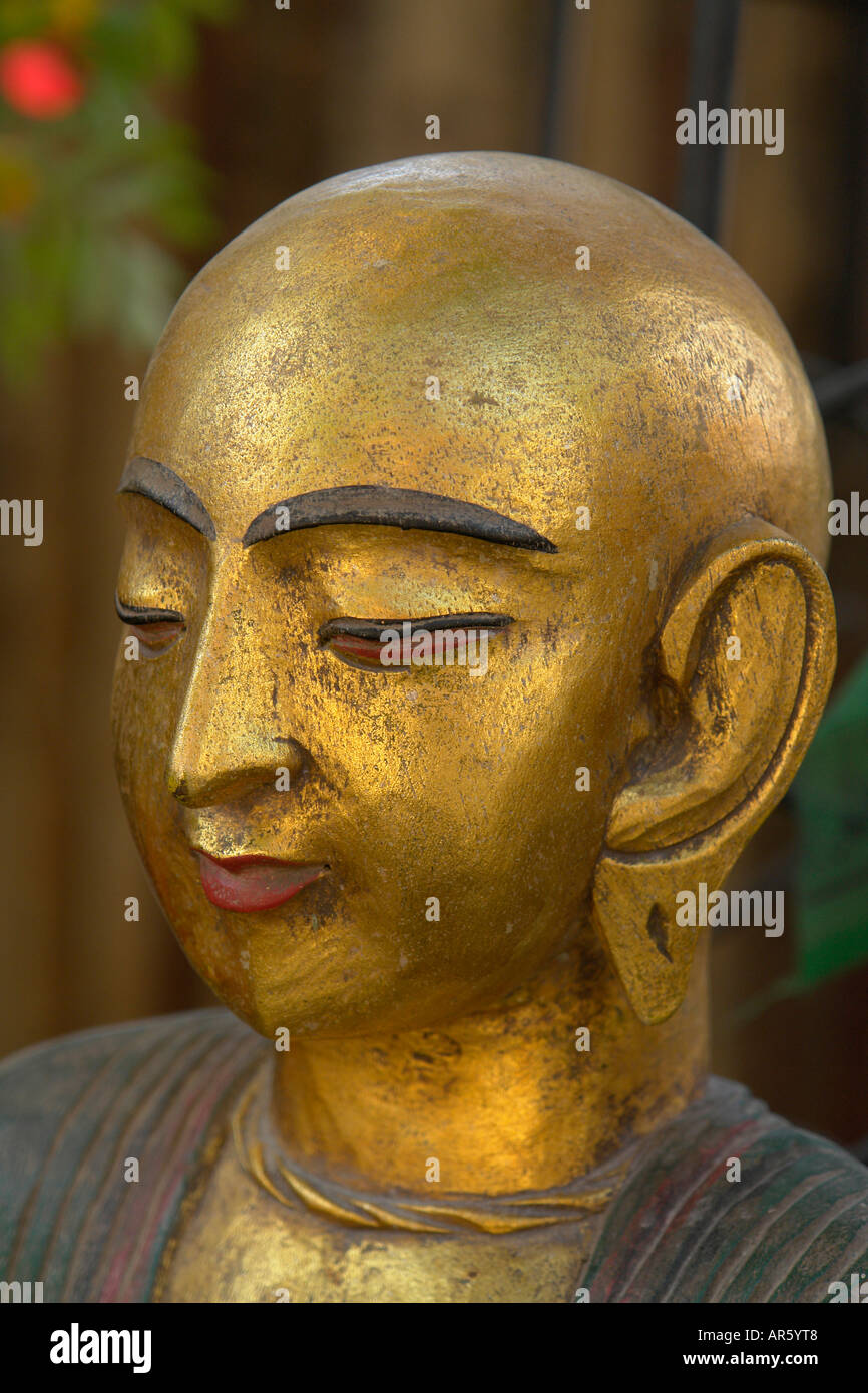 Golden statue of a holy monk Stock Photo