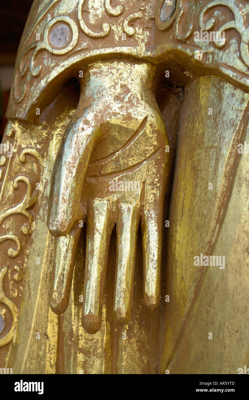 Golden hand gesture of Buddha statue Stock Photo