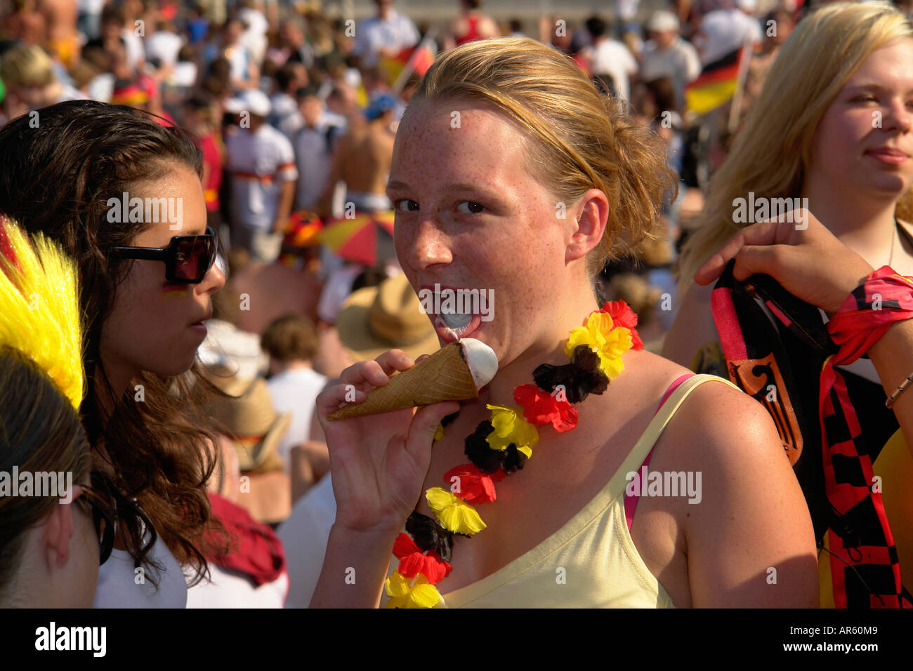 German football fans eat icecream in hot sun WM Olympia park Munich Germany  Stock Photo - Alamy