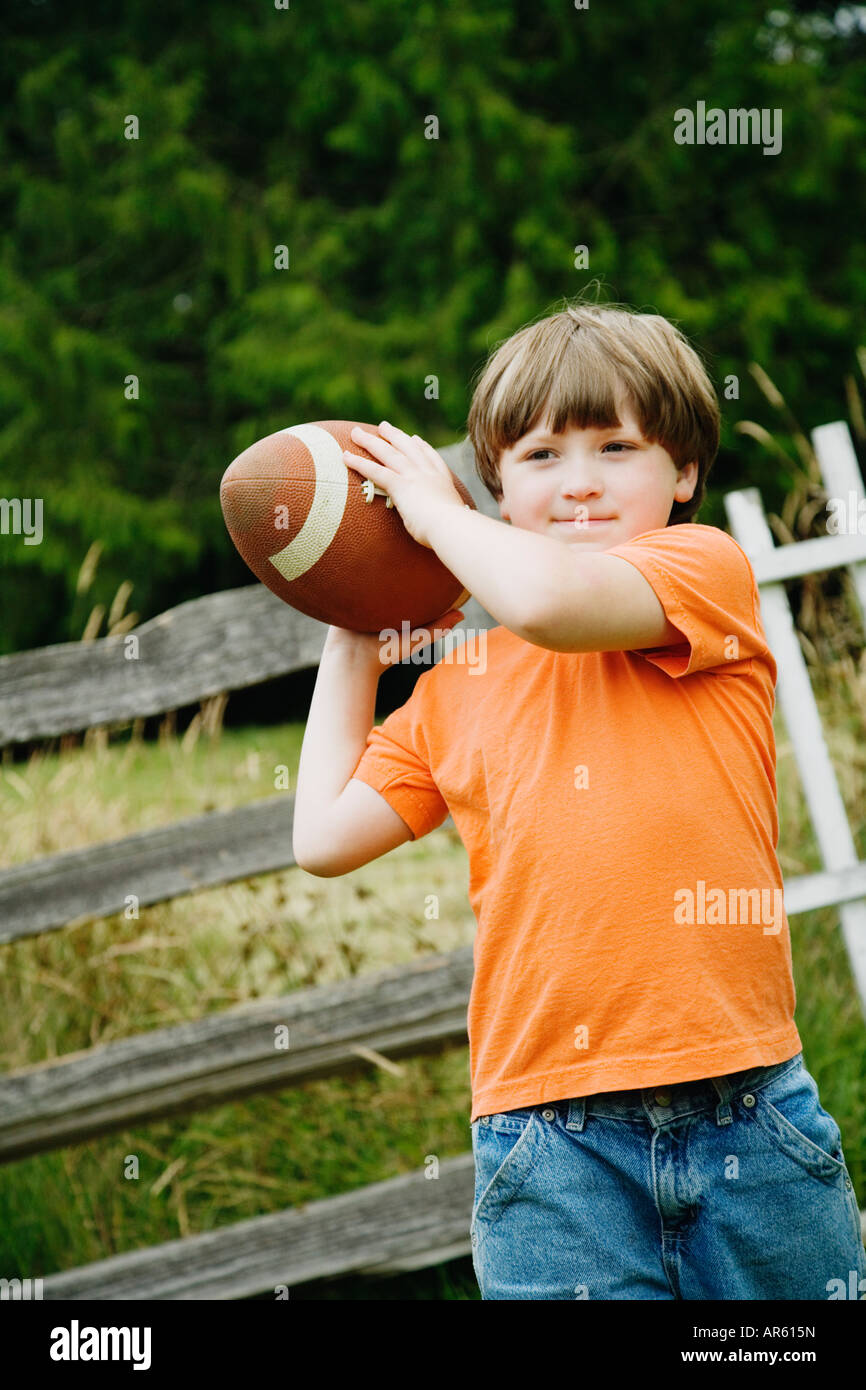 Boy throwing football Stock Photo Alamy