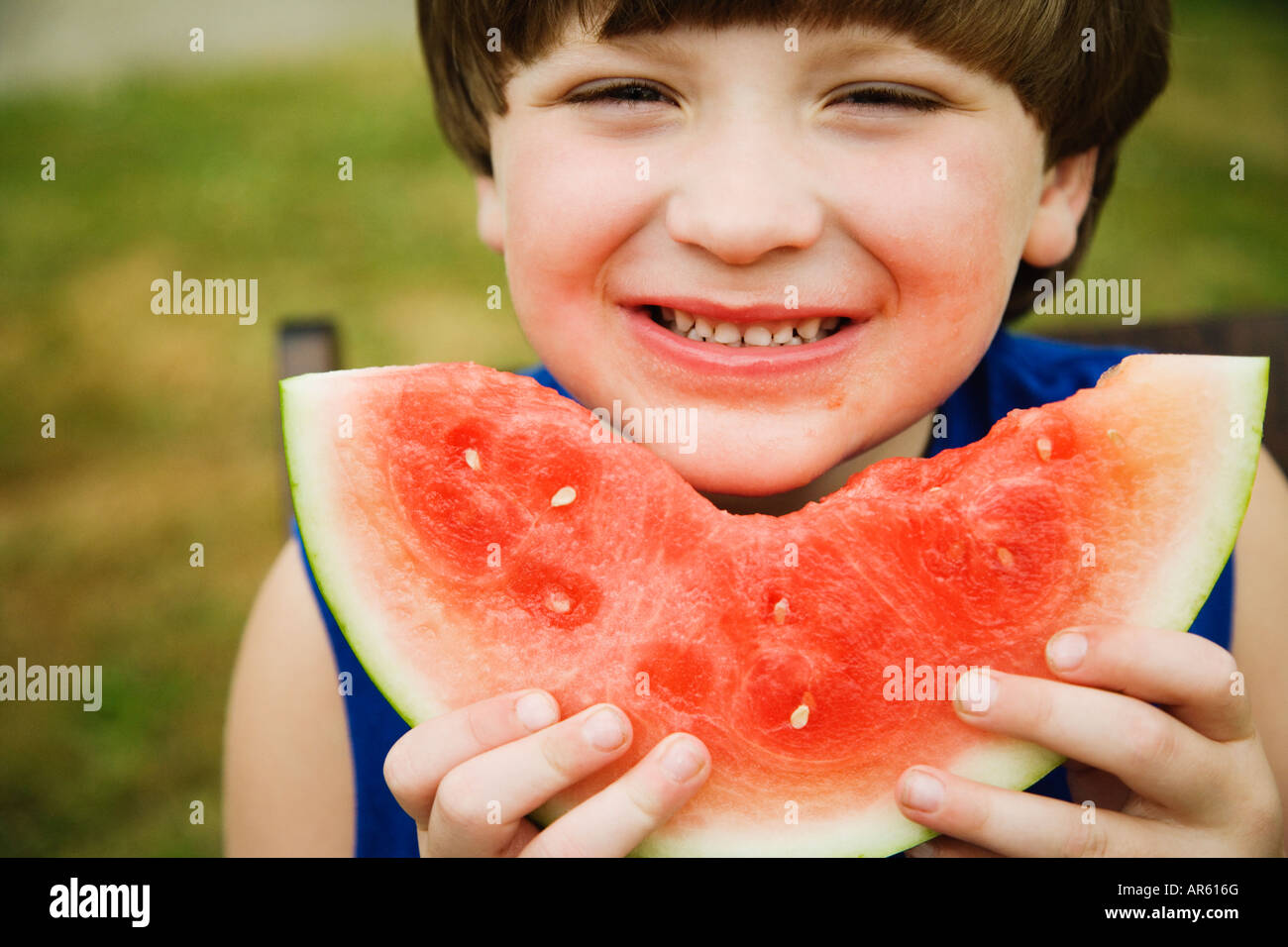 Boy eating watermelon Stock Photo Alamy