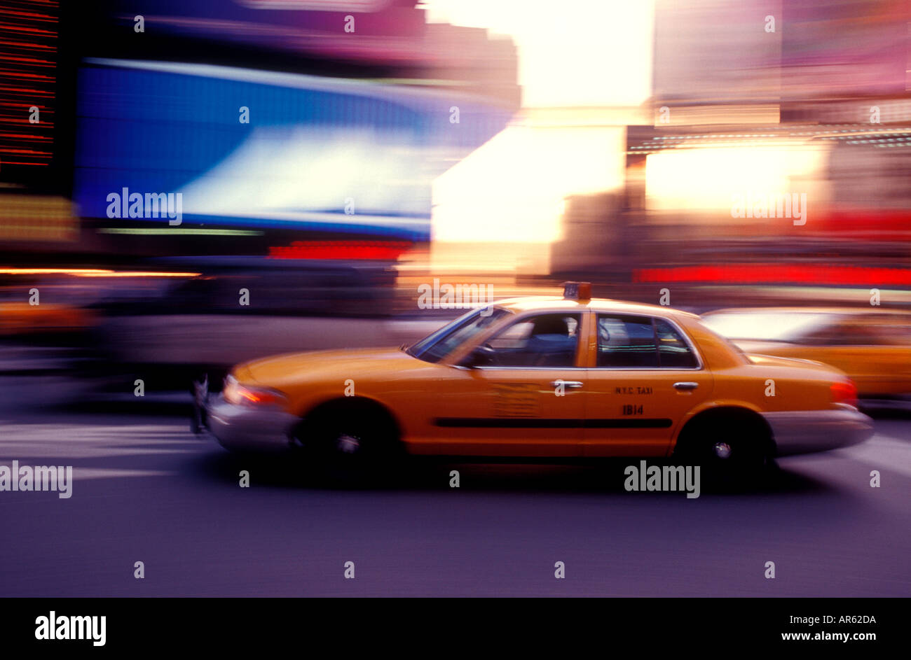 Yellow cab in Times Square speeds to destination Stock Photo