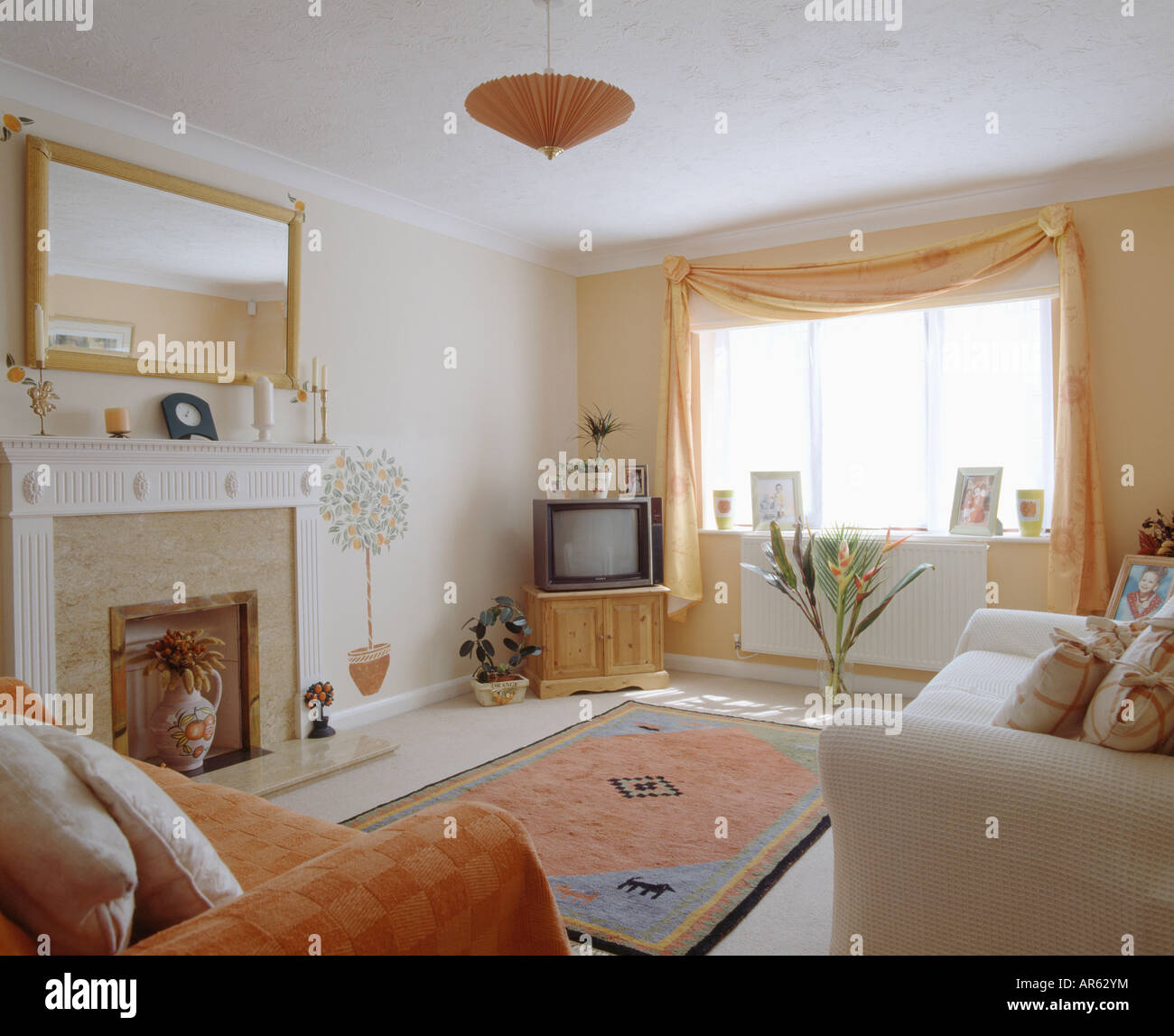 Television On Cupboard In Corner Of Living Room With Mirror