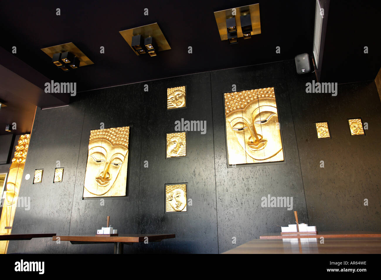 Trendy restaurant with Buddha images as decoration Stock Photo