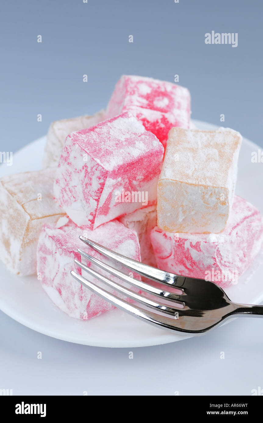 Turkish delight lokum confection on a white dessert plate Stock Photo