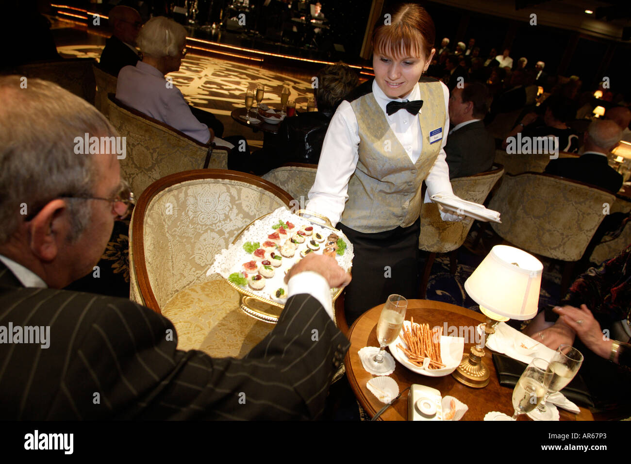 waitress, stewardess, lounge, cruise ship MS Delphin Renaissance