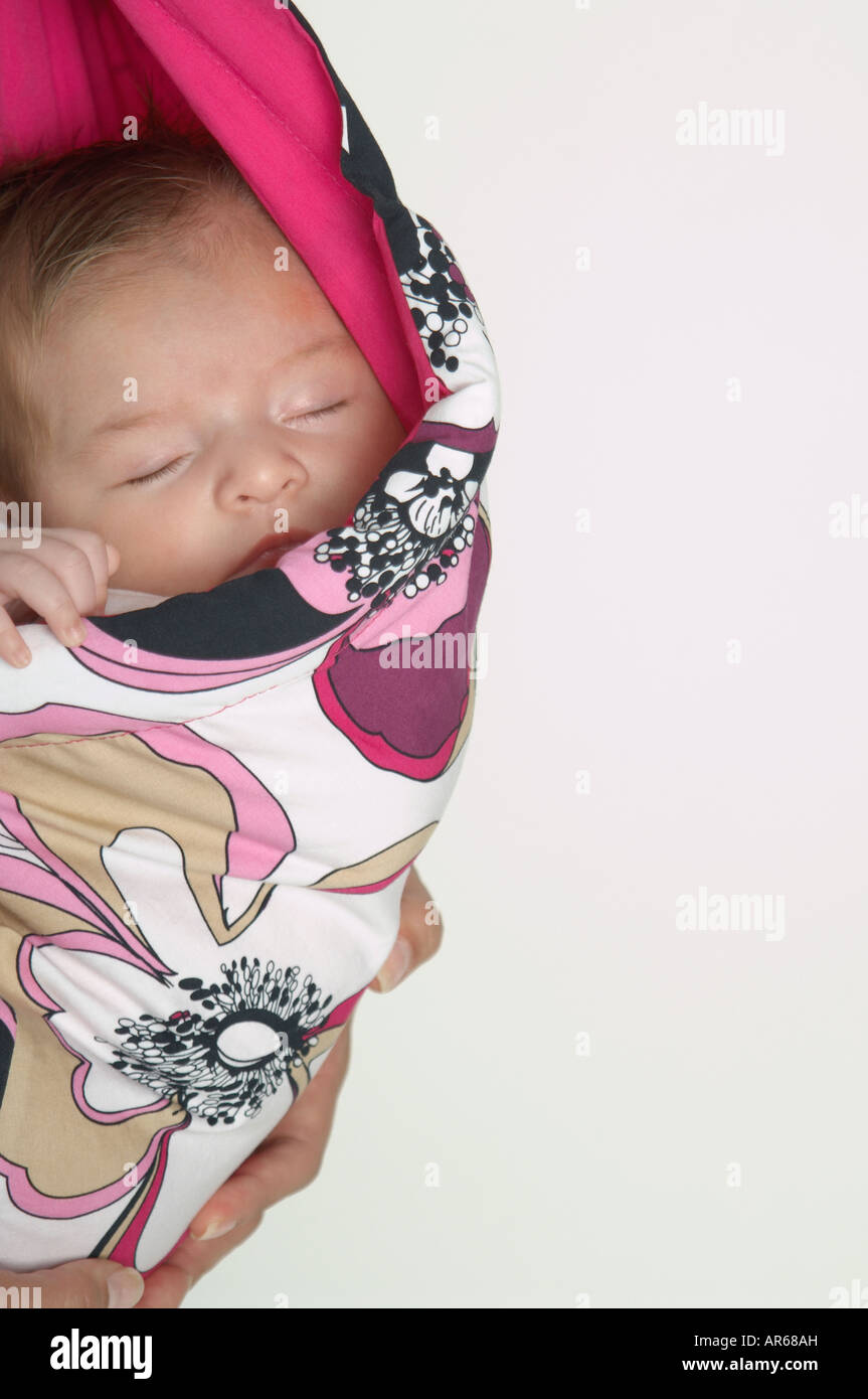 Hispanic baby sleeping in wrap Stock Photo Alamy