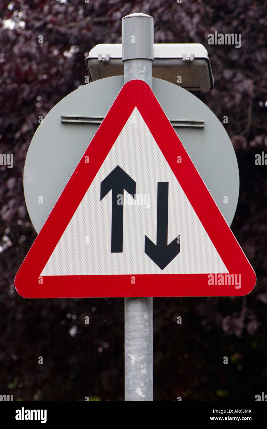 Caution two way traffic road sign Stock Photo