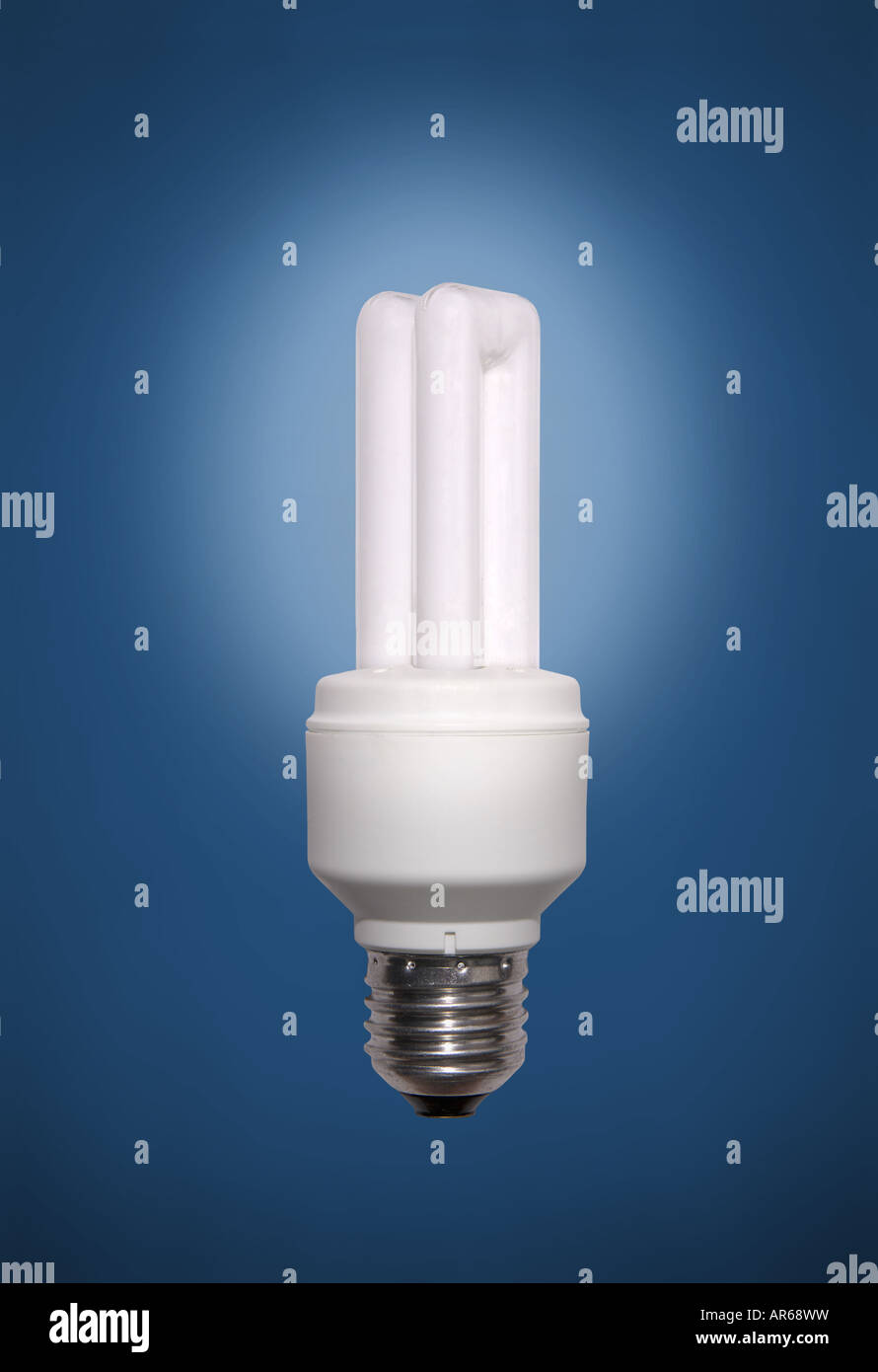 Energy saving lamp on blue background Stock Photo - Alamy