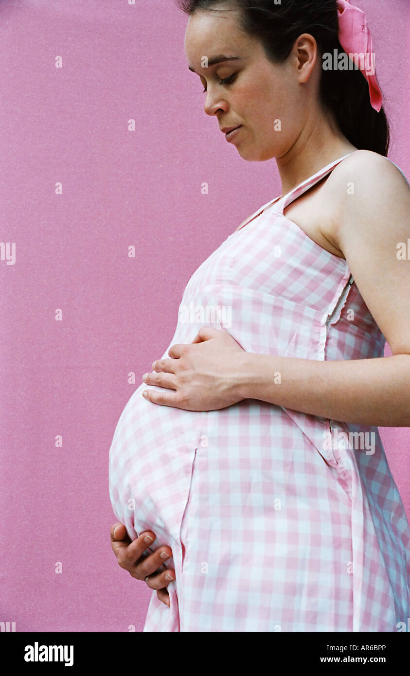 Profile of a pregnant woman Stock Photo