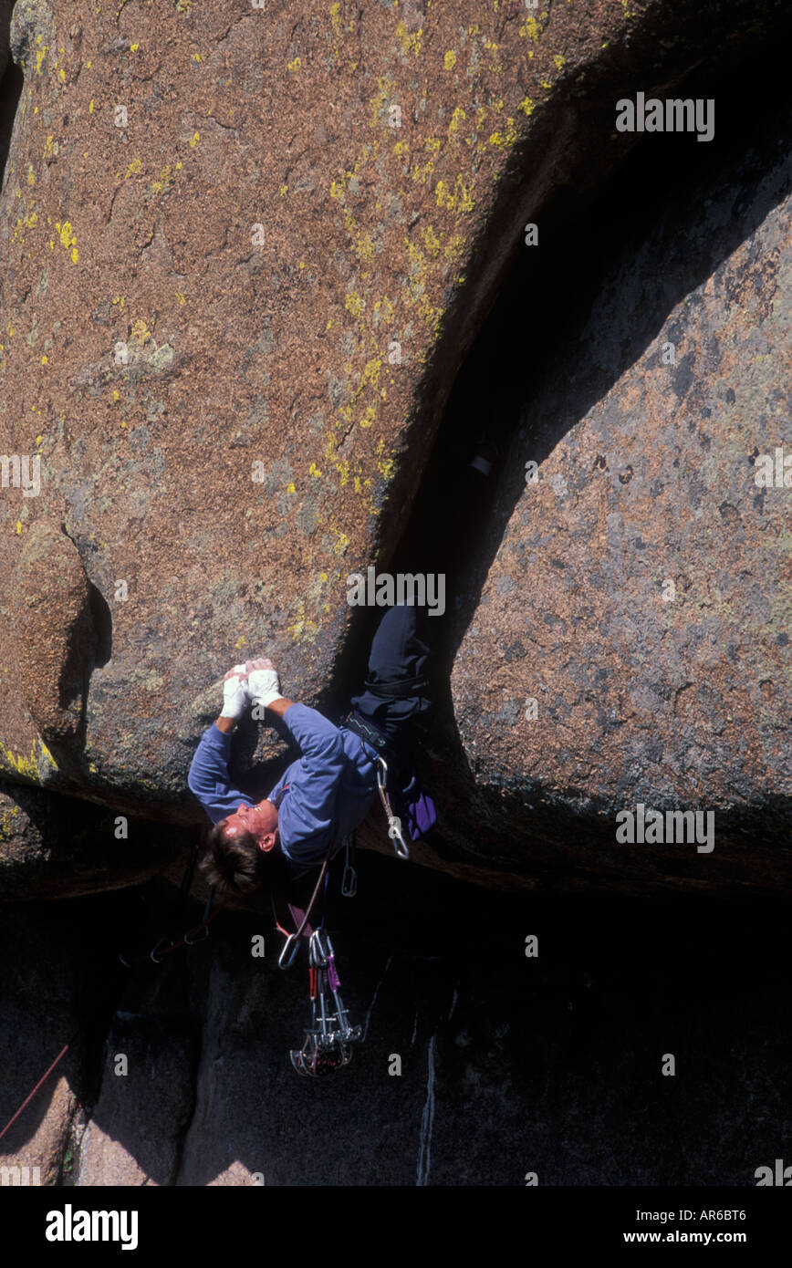 Rock climber climbing upside down Stock Photo Alamy