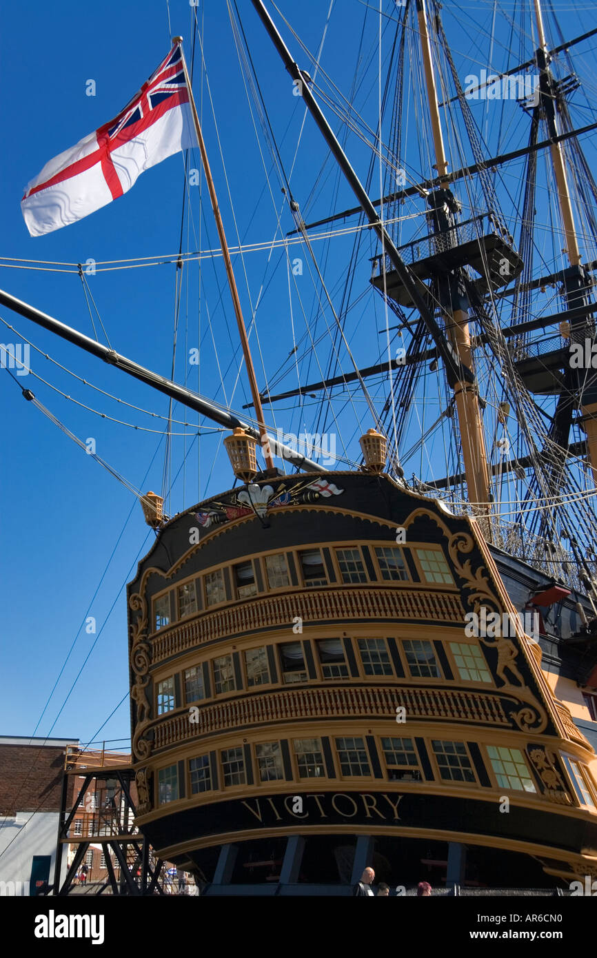 The White Ensign flag of the Royal Navy flys on the stern of HMS