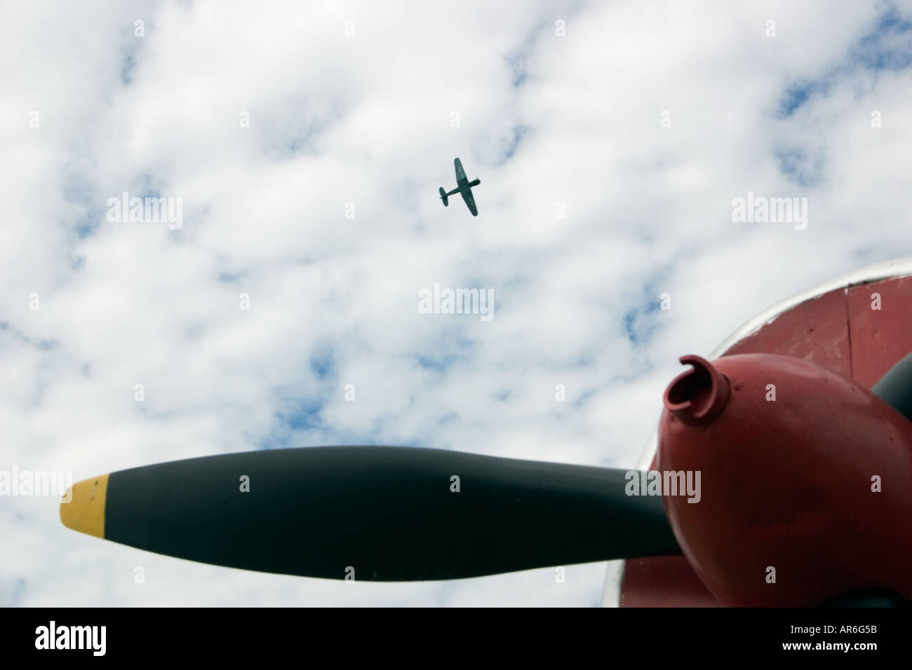 Aeroplane propeller and aeroplane in cloudy sky Stock Photo - Alamy