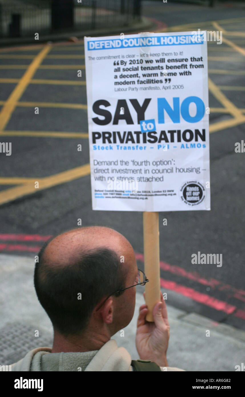 A protestor outside Southwark Town Hall demonstrating against the proposed demolition of the Aylesbury estate in South London UK Stock Photo