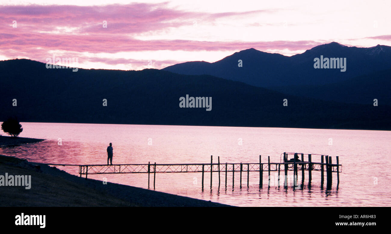 Summer sunset across Lake Te-Anau in the South Island of New Zealand ...