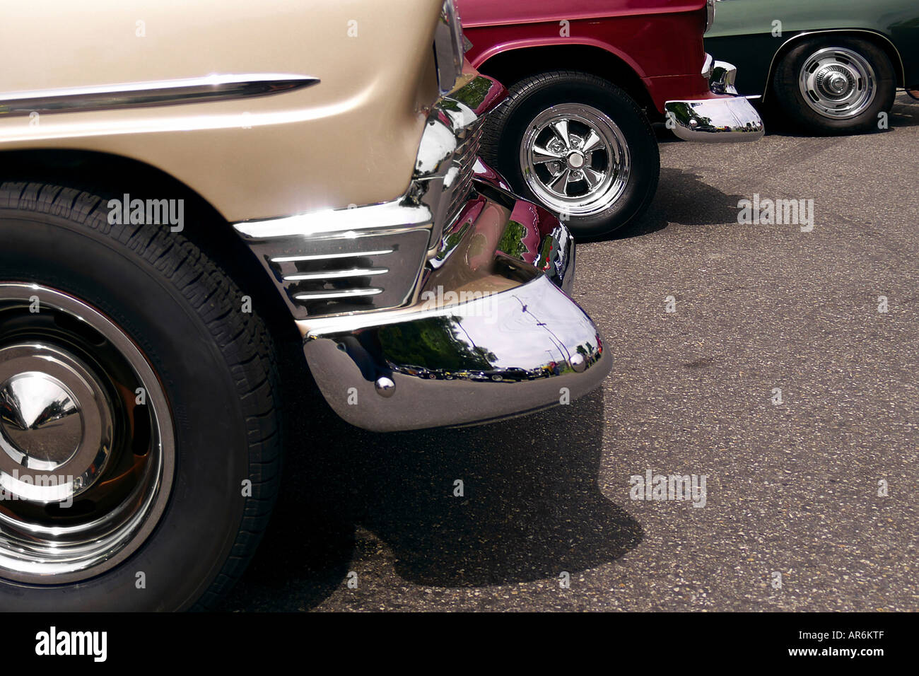 Colorful hot rodded vintage car fenders and chrome encrusted wheels on pavement Stock Photo Alamy
