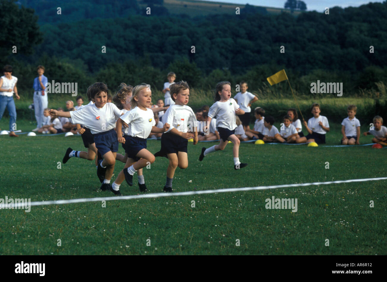 children running to the finishing line at sport's day Stock Photo