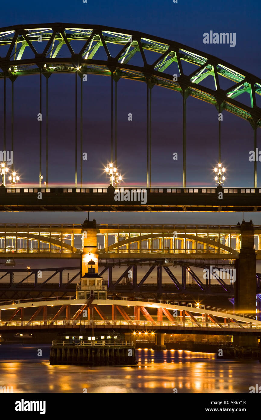 Four Tyne bridges in Newcastle upon Tyne, England, illuminated at dusk Stock Photo