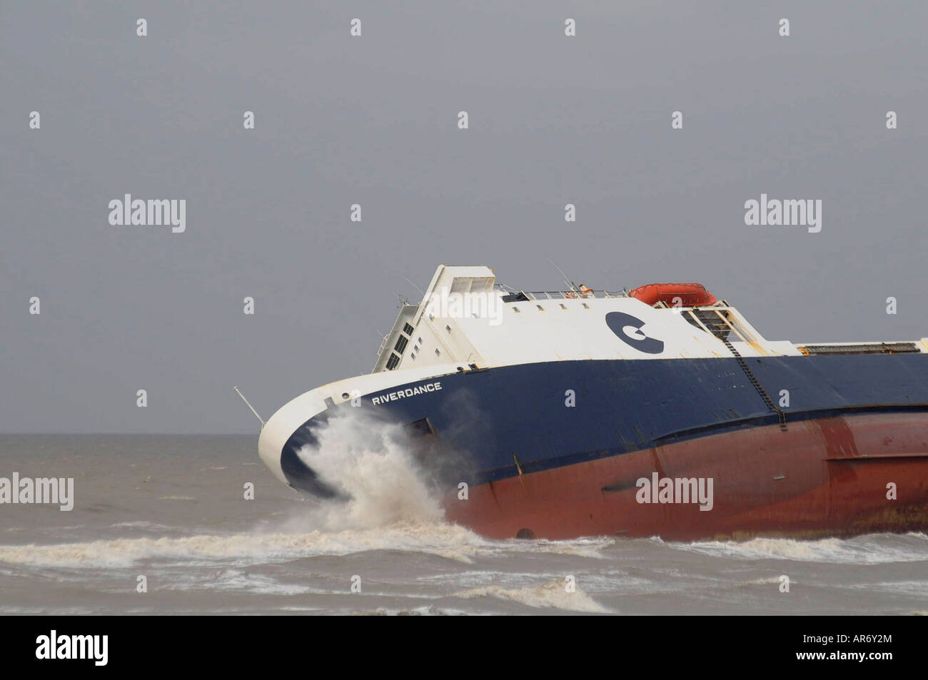 waves hitting beached ferry Riverdance Stock Photo