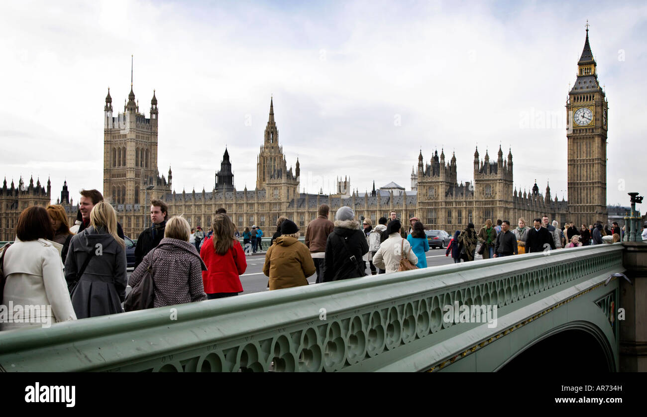 Crowds of people crossing Westminster Bridge, London Stock Photo