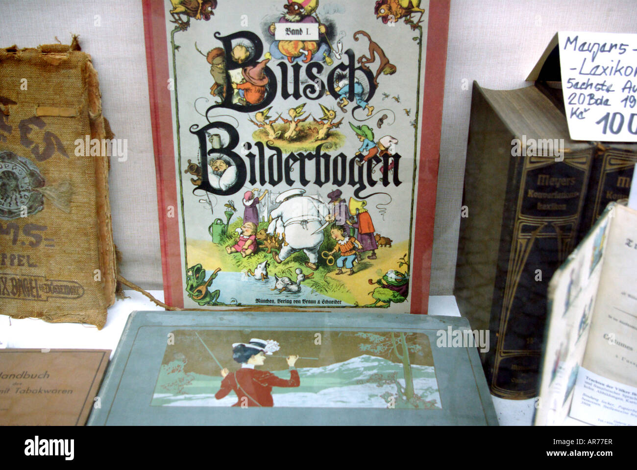 Window display at antiquarian bookshop in Stare Mesto Display features Busch Bilderbogen (sheet of pictures). Stock Photo