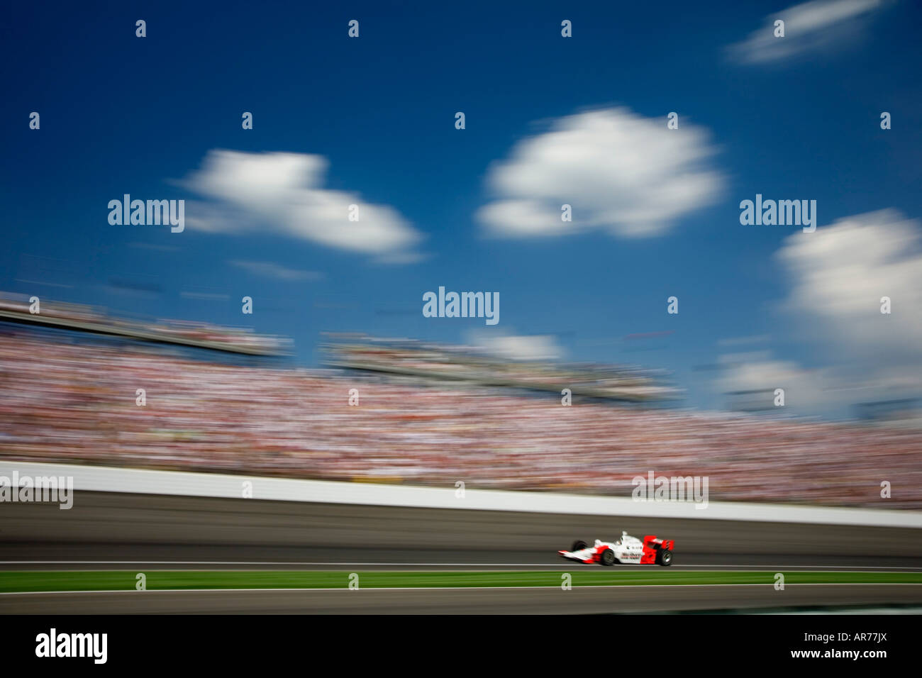 Indy race car speeds through a turn at the Indianapolis 500 in Indianapolis, Indiana. Stock Photo