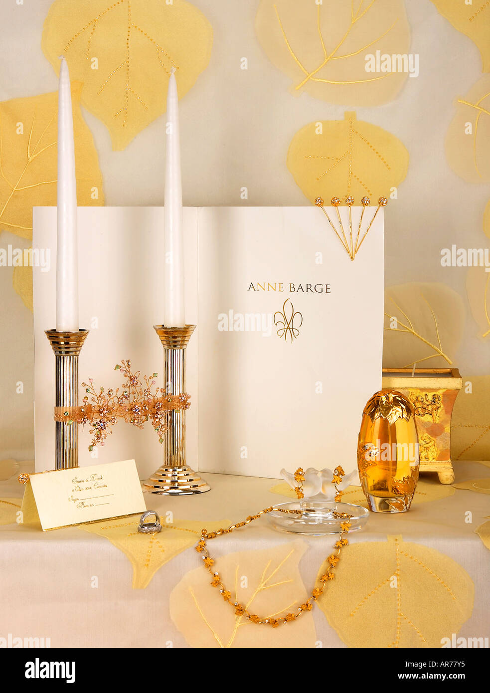 general view of some items assocaiated with a wedding including an invitation, candlestick and jewelley. Stock Photo