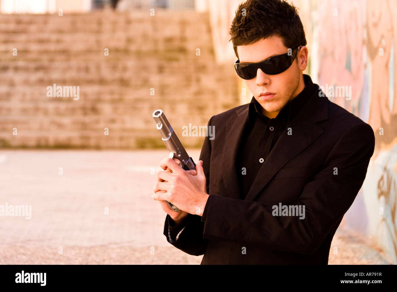 Detective with gun sunglasses hi-res stock photography and images - Page 2  - Alamy