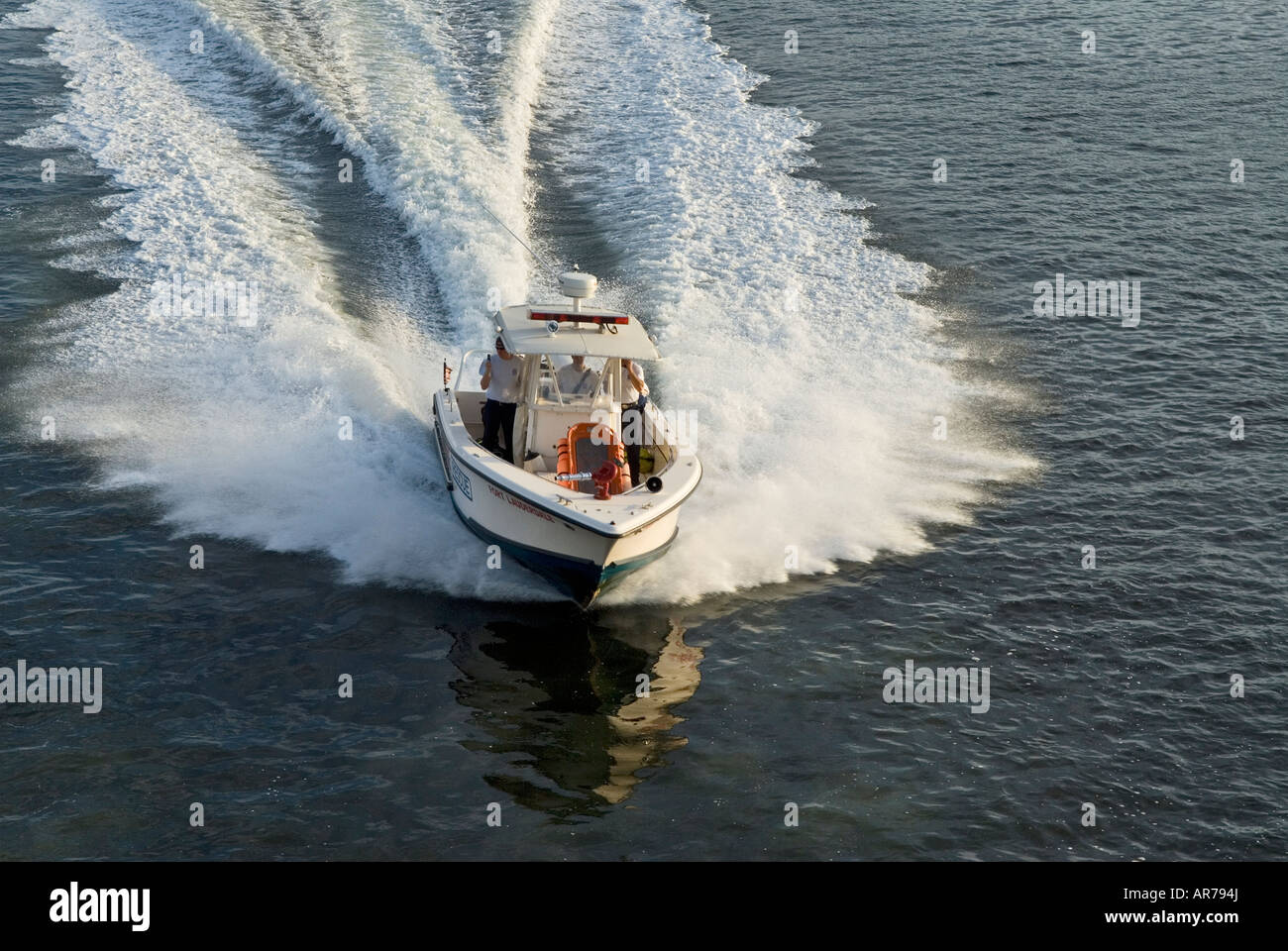 A small speedboad races through the water Stock Photo - Alamy