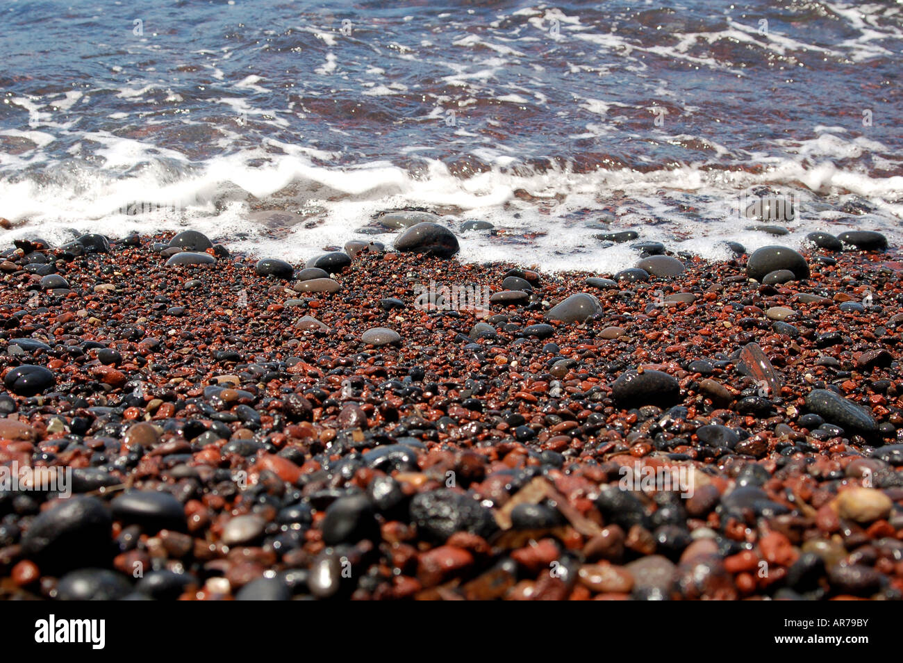Rusty Reddis Beach Rocks A red and black rocky beach in Europe Stock Photo - Alamy