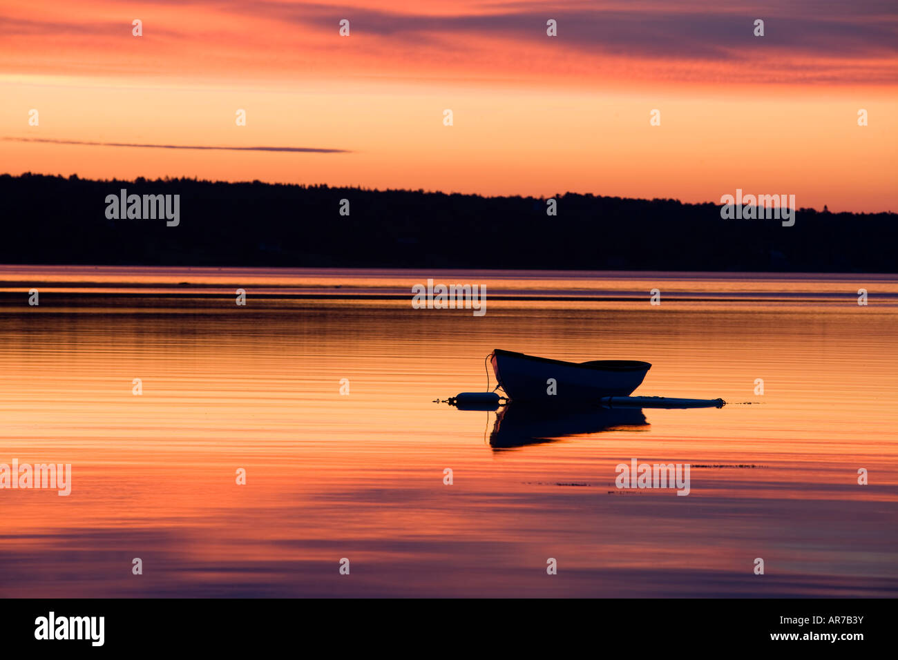 A skiff at sunrise in Eggemoggin Reach in Little Deer Isle, Maine Stock