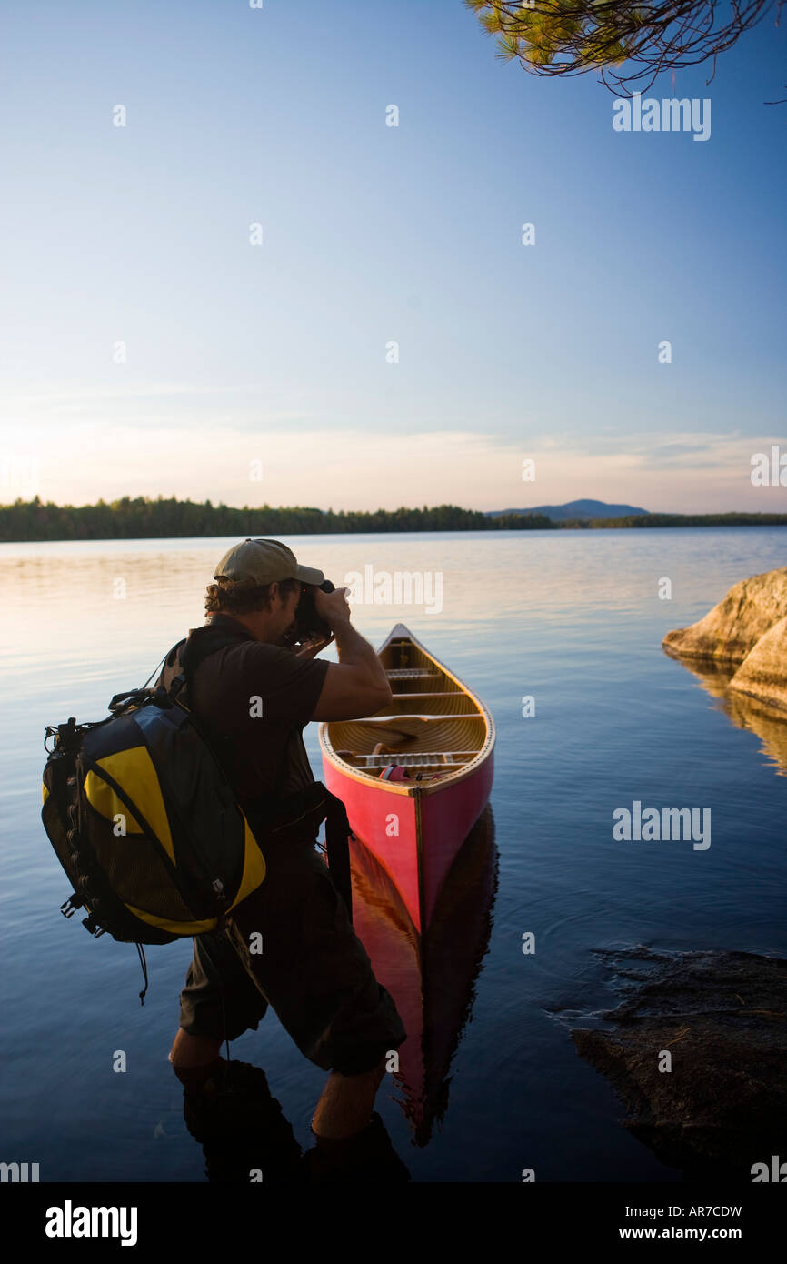 A photographer on Seboeis Lake near Millinocket, Maine. Stock Photo
